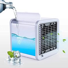 an air conditioner being filled with water next to ice cubes and mint leaves