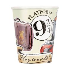 a paper cup with an image of suitcases on the front and bottom, says platform 9