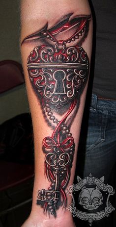 a tattoo with a lock and key on it