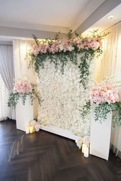 flowers and greenery decorate the backdrop for an event