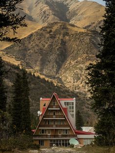 a house with mountains in the background