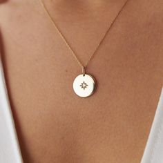 Introducing our Coin Medallion Necklace, a symbol of guidance and elegance. Crafted in 14k solid gold, this timeless piece features a striking North Star at the center, radiating with a natural round-cut diamond. With a polished gold finish, this necklace embodies the perfect balance of sophistication and simplicity, making it an exquisite addition to any collection.  Necklace Features   Gold Kt: 14Kt Solid Gold - All pieces are stamped for authenticity Gold Color: Yellow Gold Center Diamond Wei Gold Circle Pendant Necklace, Diamond Star Necklace, North Star Necklace, Circle Pendant Necklace, Necklace Diamond, Medallion Necklace, Coin Necklace, North Star, Circle Pendant