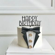 a birthday cake with a tuxedo on top