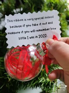 someone is holding a christmas ornament with a message on it that says, this ribbon is very special need because if you take it out and measure it