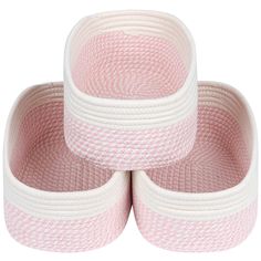 three pink and white baskets stacked on top of each other