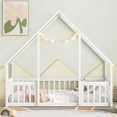 a white dollhouse bed with lights on the ceiling