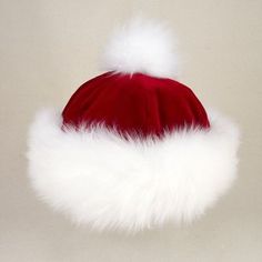 a red santa hat with white fur on top