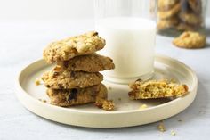 cookies and milk on a plate next to a glass of milk