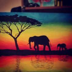 an elephant and her baby are silhouetted against a sunset painting on canvas by the water