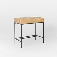 a wooden table with metal legs and a drawer on the top, against a white background