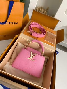 Indulge in a touch of Parisian chic with this Capucines Mini-inspired handbag. This exquisite bag, rendered in a captivating shade of pink, captures the essence of Louis Vuitton's timeless elegance. Crafted with meticulous attention to detail, it features a structured silhouette, a flap closure with the signature LV Initials clasp, and a detachable shoulder strap for versatile carrying options. Whether heading to a brunch date or a glamorous evening event, this compact and luxurious bag is the p Lv Capucines Mini, Lv Capucines, Capucines Mini, Shade Of Pink, Louis Vuitton Capucines, Fall Winter Jacket, Louis Vuitton Pink, Brunch Date, Mini Pink