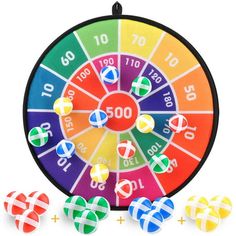 an image of a wheel of fortune game with four candy candies on the side