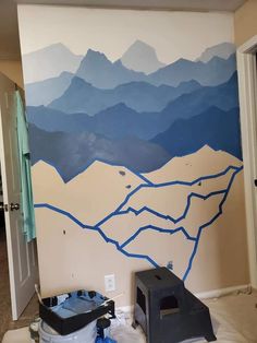 there is a painting on the wall in this room that has mountains painted on it