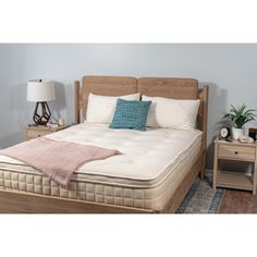 the mattress is made and ready to be used in the bedroom or as a night stand