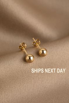 🚚 TO QUALIFY FOR FREE SHIPPING US Orders * Free Shipping on all US Orders over $35 CA Orders * Free Shipping on all Canadian Orders over $70 Worldwide Orders  * Free Shipping on all Worldwide Orders over $70 Please note: Free Shipping will be automatically applied to all qualifying orders. 14K Gold Filled Ball Stud Earrings. The perfect starter stud. It'll go with everything. Classic cute and dainty.  These are Lightweight and Comfortable. These simple ball Studs Earrings are Perfect to Wear Da Dainty Gold Earrings, Ball Stud Earrings, Studs Gold, Tiny Studs, Tiny Stud Earrings, Earrings Minimalist, Gold Filled Jewelry, Selling Jewelry, Minimalist Earrings