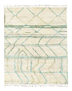 a white rug with blue and green lines on it