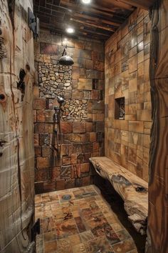 a rustic bathroom with stone walls and flooring is shown in this image, there are two wooden benches on the left side of the shower