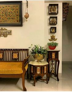 a living room filled with furniture next to a wall mounted art on it's walls