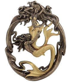 a mirror that has a mermaid on it