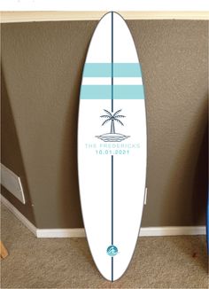 a white surfboard sitting on top of a carpeted floor next to a wall