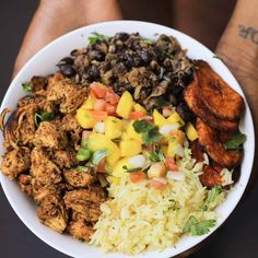 a white bowl filled with lots of different types of food