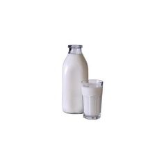 a milk bottle and glass sitting next to each other on a white background with no one in it