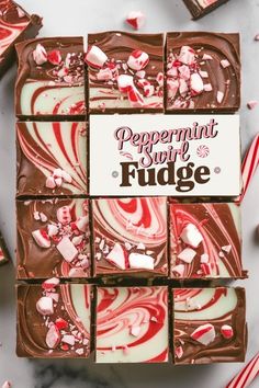 peppermint swirl fudge chocolate squares with candy canes around them on a marble surface