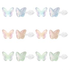 six butterflies with different colors and shapes on them, all in pastel pink and white