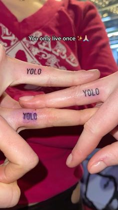 three fingers with words written on them and the word you only live once in different languages