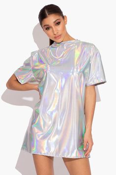 Catch eyes and turn heads this festival season in our Oversized Holographic T-Shirt. Get summer ready with our oversized tee. It’s the perfect poolside cover up during the day or add biker shorts and heels for a holographic evening look. Designed in London for KARIZMAFabric: Polyester Length: 77cmGentle dry clean or gentle hand wash in cold water and hang to dry. Model is 5 ft 7 and wears a size smallPlease use our size guide for body measurements when purchasing, our garments run true to size! Holographic Heels Outfit, Holographic Party Outfit, Holographic Clothing, Metallic Summer Tops For Festival, Summer Rave T-shirt With Graphic Print, Summer Rave Crew Neck Top, Summer Rave Streetwear Tops, Summer Rave Crew Neck T-shirt, Summer Rave Style Crew Neck T-shirt