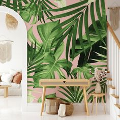 a living room with pink and green wallpaper, white stairs and wooden table in the foreground