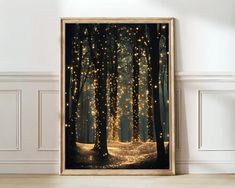 an art print with lights in the woods