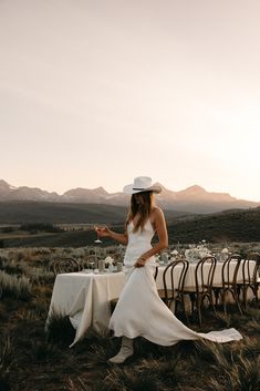 Country wedding, bride in a simple silk wedding dress with a cowboy hat and boots Stanley Idaho Wedding, Cowgirl Bride, Summer Gowns, Western Themed Wedding, Cowgirl Wedding, Cowboy Wedding, Montana Wedding, Bridal Photoshoot, Satin Wedding Dress