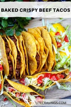 several tacos with lettuce, tomatoes and other toppings