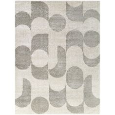 a gray and white rug with circles on it