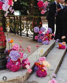 colorful flowers are placed on the steps outside