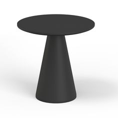 a black round table sitting on top of a white floor