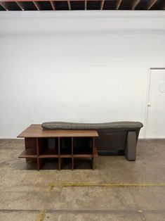 a couch and table in an empty room with no one on the floor or furniture