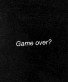 a black and white photo with the words game over