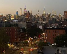 the city skyline is lit up at night