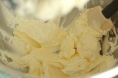 a mixing bowl filled with white batter