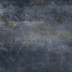 an old, grungy surface with yellow and gray paint on the bottom half