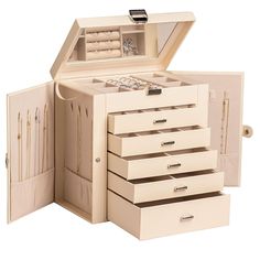 an open jewelry box with several drawers