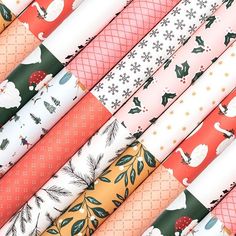 twelve different colored christmas paper rolls on top of each other with the words 12x2 patterned