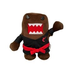 a brown stuffed animal wearing a black shirt and red bow tie with teeth on it's head