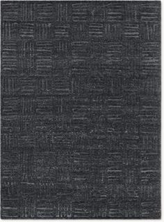 an area rug that is black and has small squares on the top, with one square in