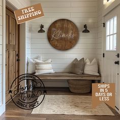 a wooden sign that says free shipping hangs on the wall next to a bench with pillows