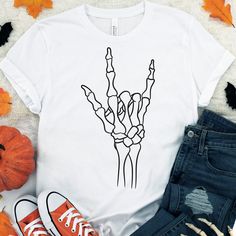 a t - shirt with an image of a hand drawn on it