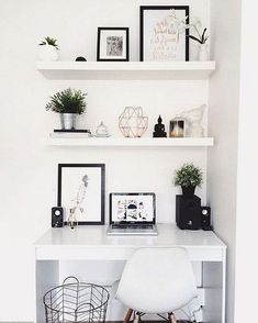 a white desk with some pictures on it