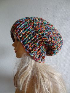 a mannequin head wearing a multicolored knitted slouch hat